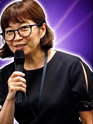 Michelle Ten, CEO of AccountingBPO, speaking with a microphone at the ISCA Tech Fair.